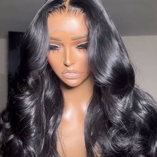 Front view of a black body-wave wig on a mannequin, showing the center part, lace hairline, and styled waves.