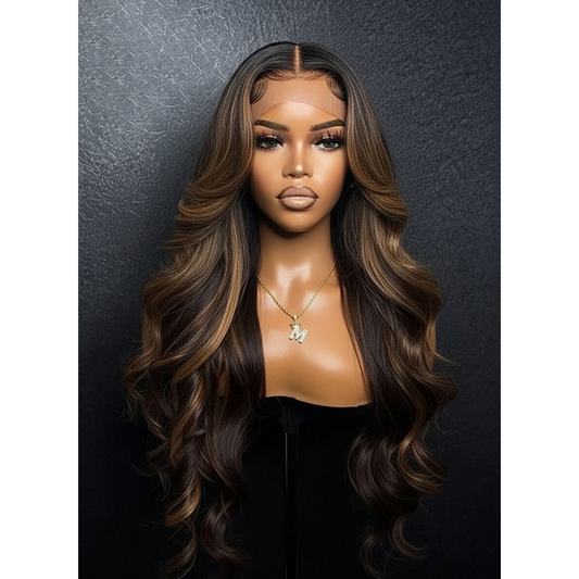 Mannequin head with long, wavy brown wig against a dark background