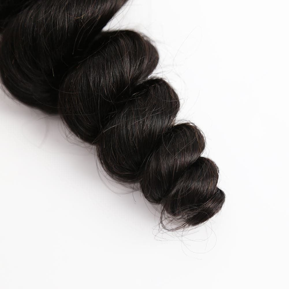 Black hair bundle with loose wave on a white background